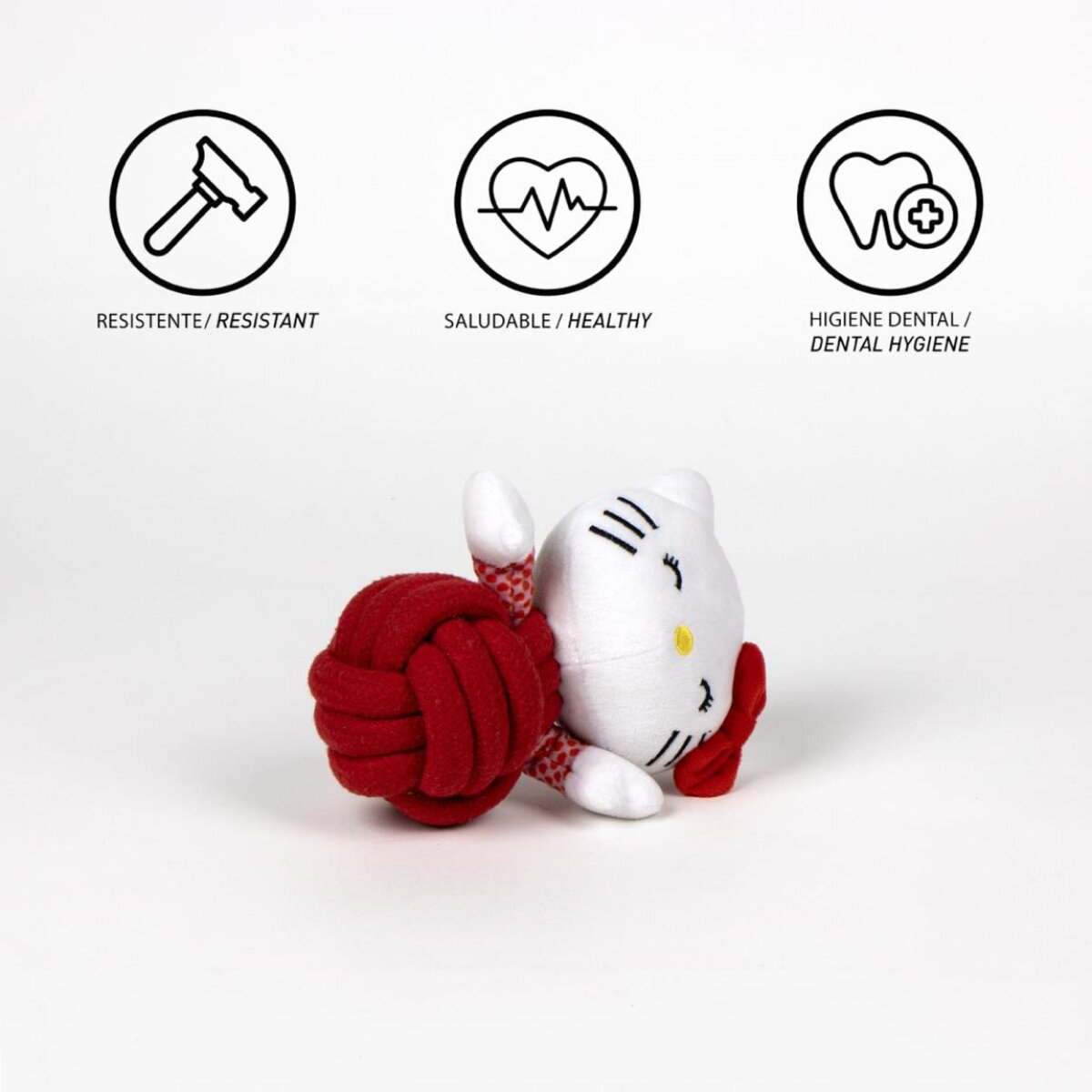 Ein weißes Hello Kitty-Spielzeug mit einem roten geknoteten Seil. Symbole für robust, gesund und Zahnhygiene oben.