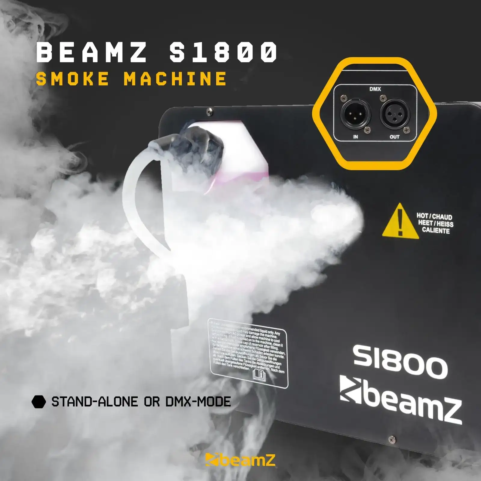 Máquina de humo negra con humo blanco. La marca es beamZ. Conectores DMX y una señal de advertencia.