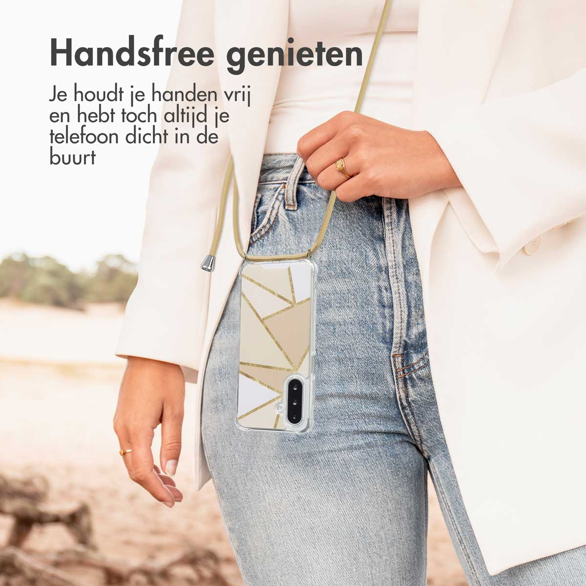 A woman wearing a phone with a geometric case. The phone is hanging.
