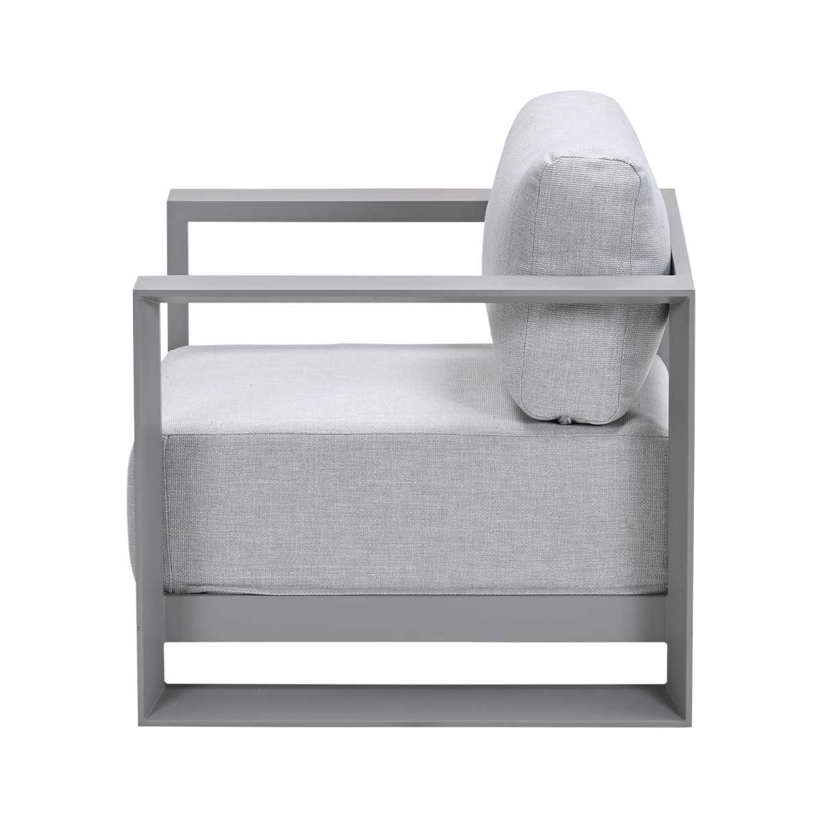 Side view of gray outdoor armchair with square frame and gray cushions, on white background.