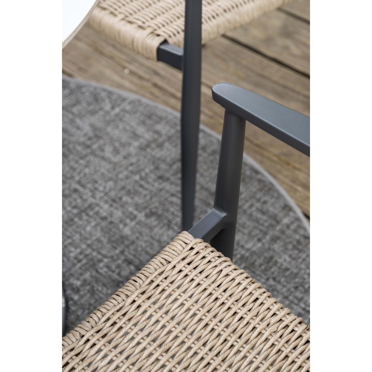 Close-up of a chair seat and armrest. The seat is woven with light brown material. The frame is gray.