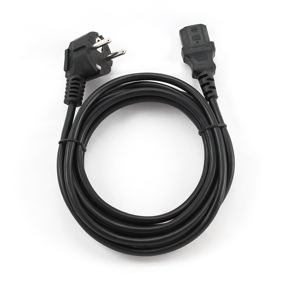 Cable de alimentación negro enrollado sobre superficie blanca, con dos enchufes.
