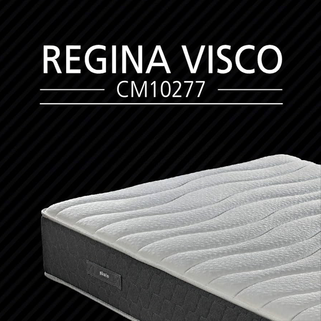 Un colchón con el texto 'REGINA VISCO' y 'CM10277' sobre un fondo negro con líneas diagonales.