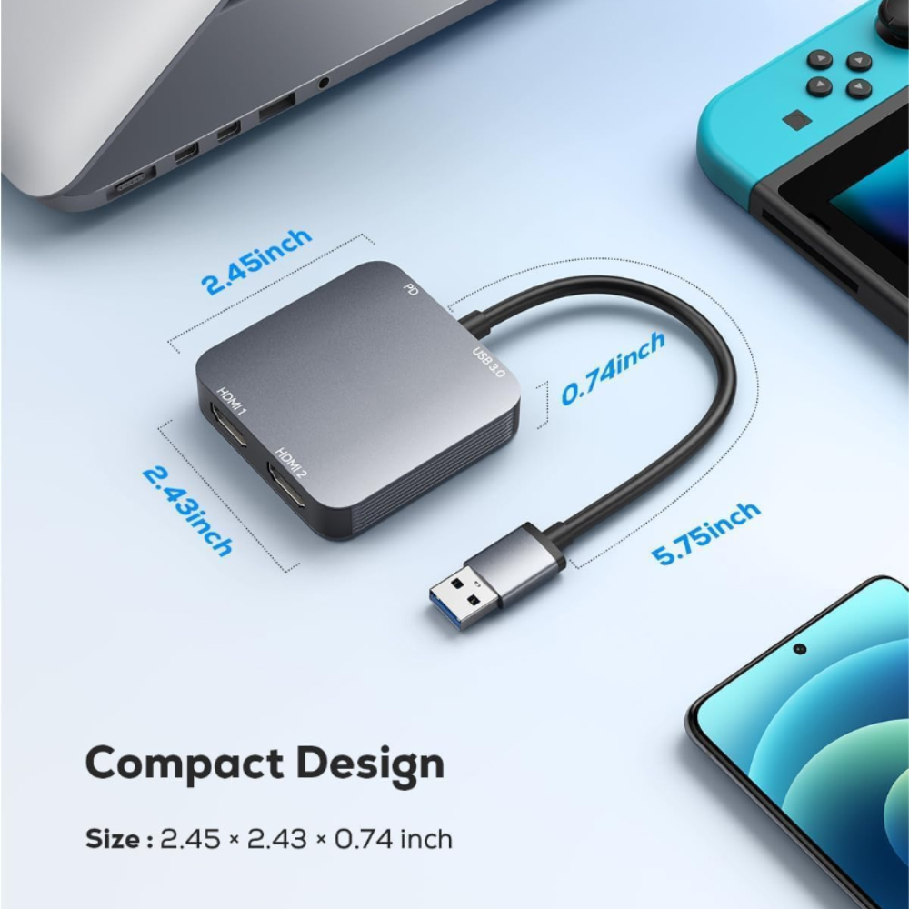 Ein kompakter Hub mit USB-Kabel. Er hat HDMI- und USB-Anschlüsse und liegt neben einer Spielkonsole und einem Telefon.