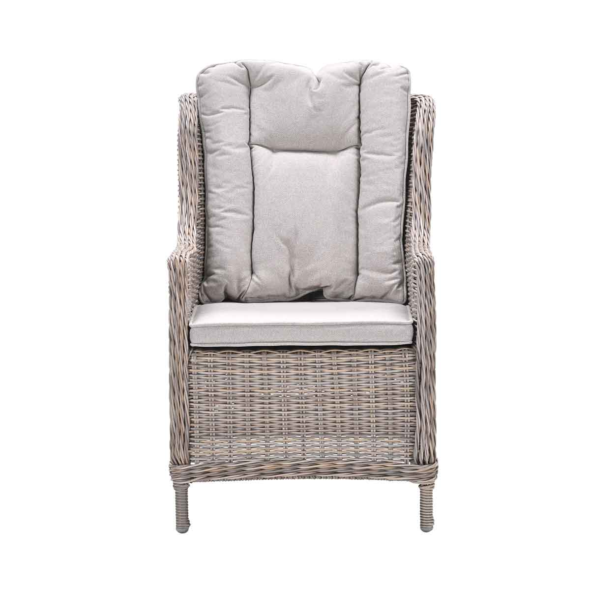A wicker chair with a high back, gray cushions, and a white background.