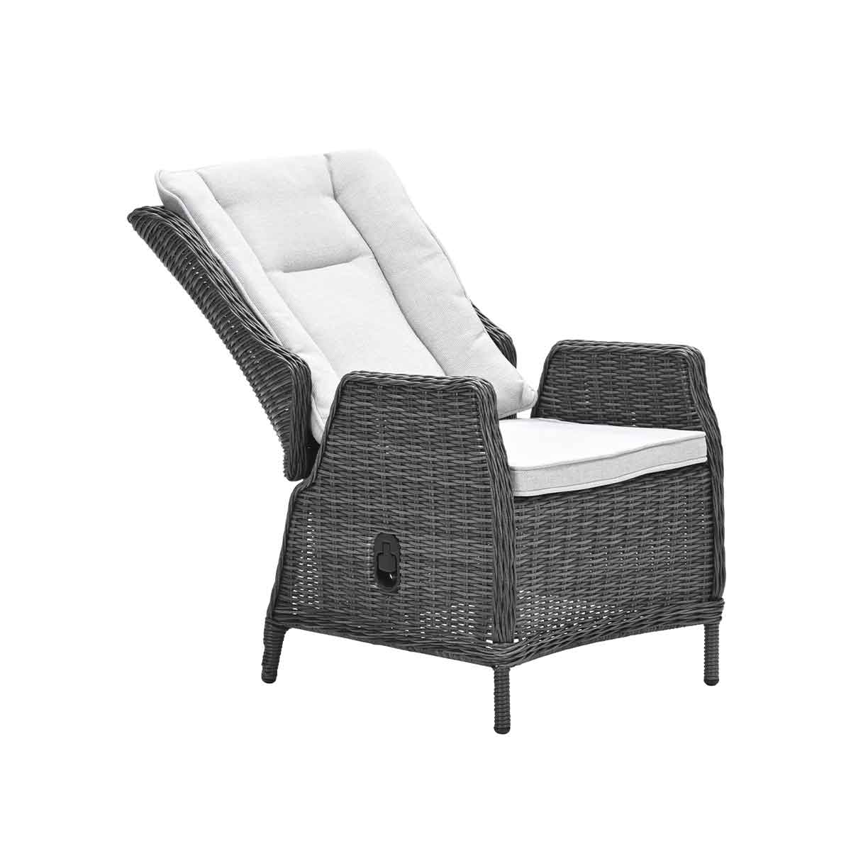 Wicker chair with a reclining back and a white cushion, isolated on white.