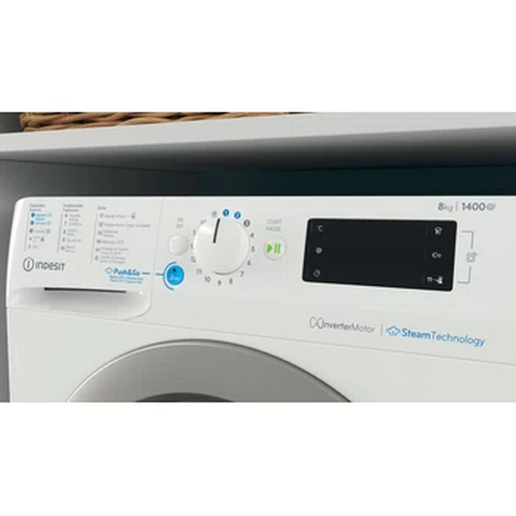 Panel de control de lavadora Indesit blanca con dial y varios botones.