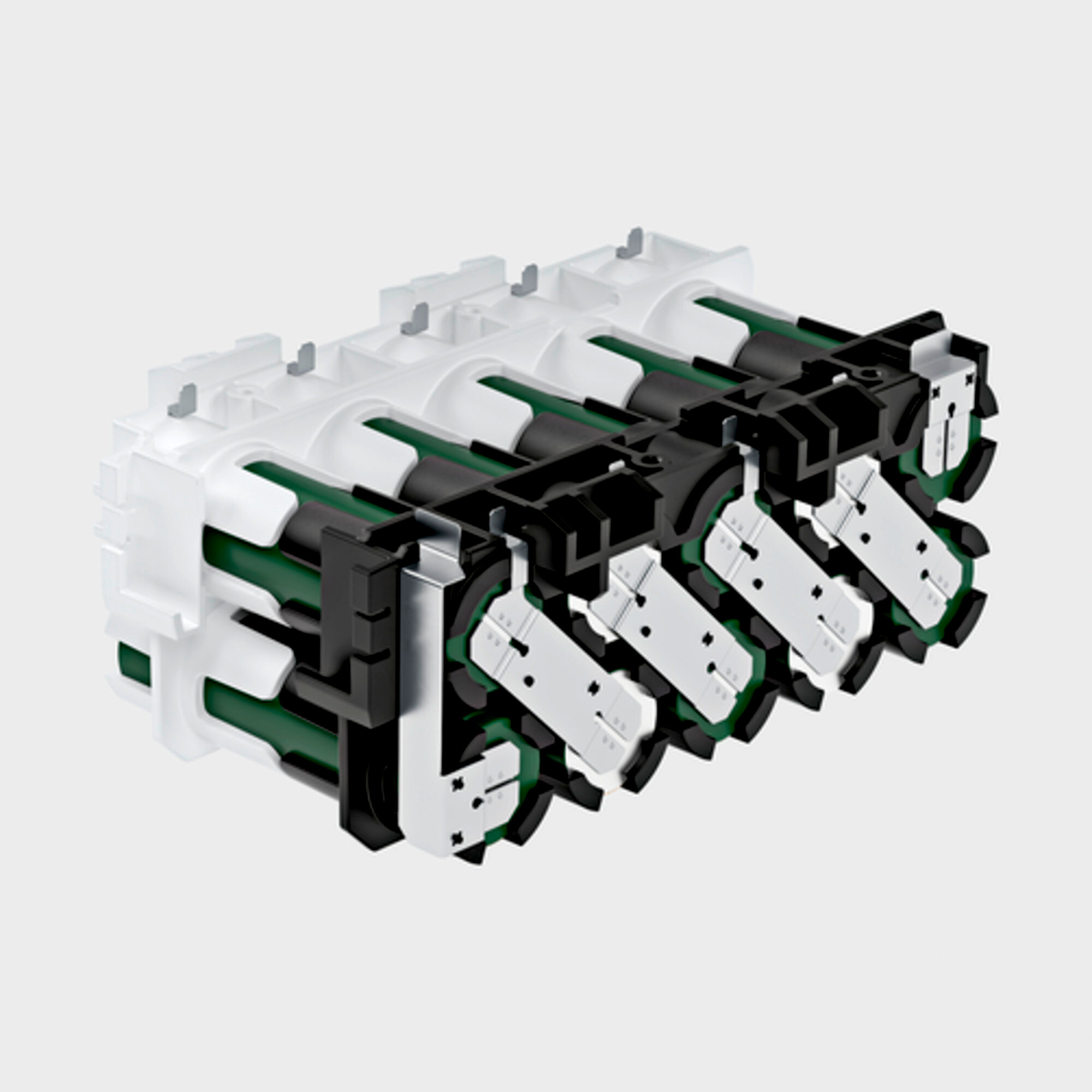 Przekrój akumulatora pokazujący zielone ogniwa oraz czarne i białe plastikowe elementy.