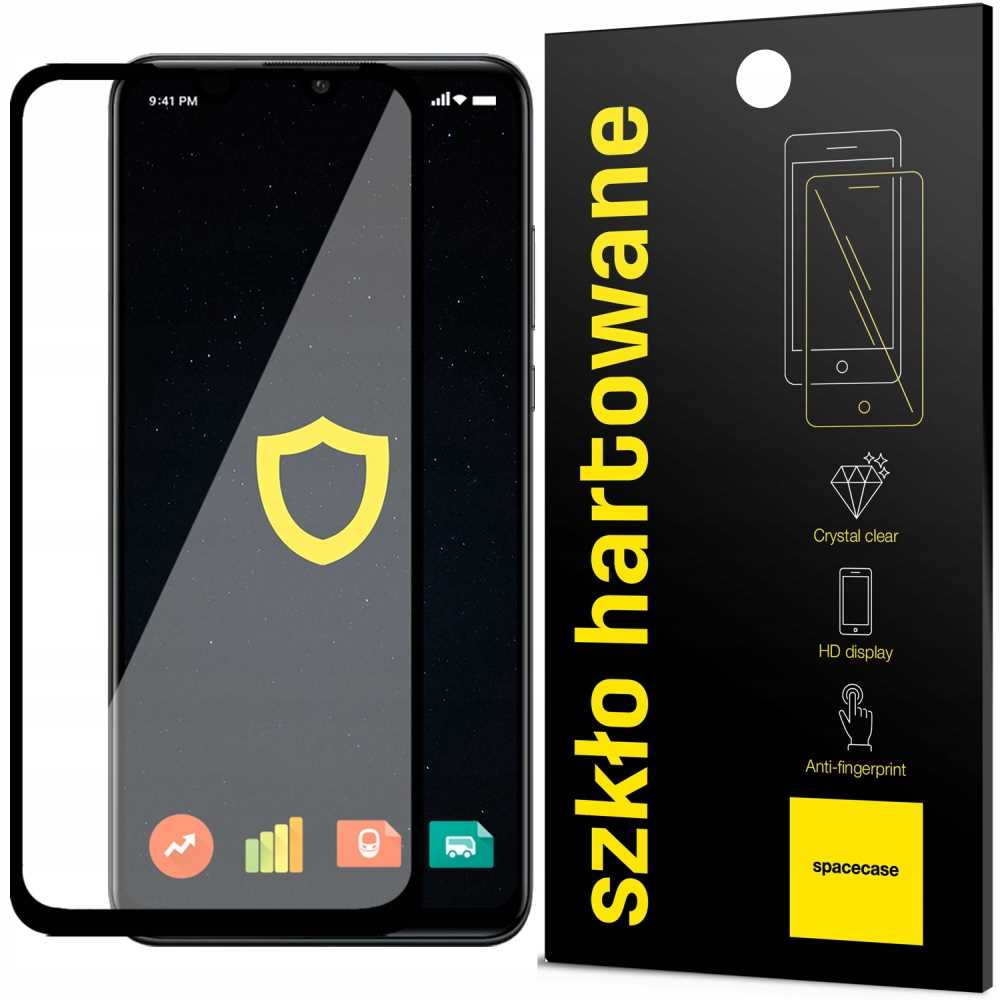 Telefon z ochraniaczem ekranu. Wyświetla godzinę i sygnał. Logo tarczy na ekranie.