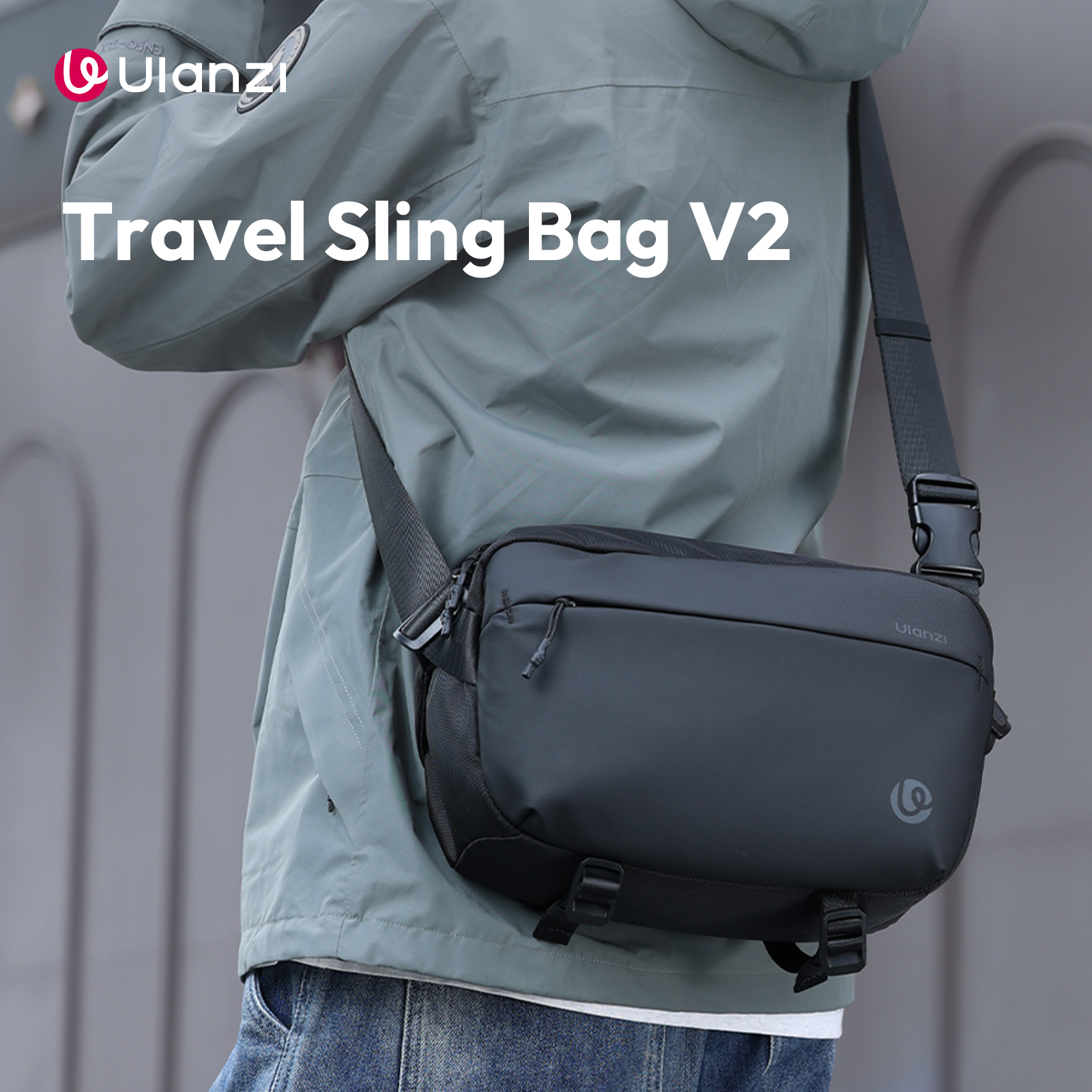 A person is wearing a jacket and carrying a black travel sling bag with the text 'Travel Sling Bag V2'.