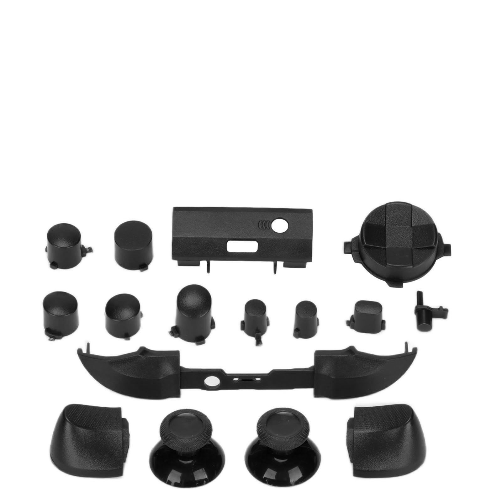Verschiedene schwarze Komponenten für einen Gamecontroller, einschließlich Knöpfen, Joysticks und einem Mittelteil.