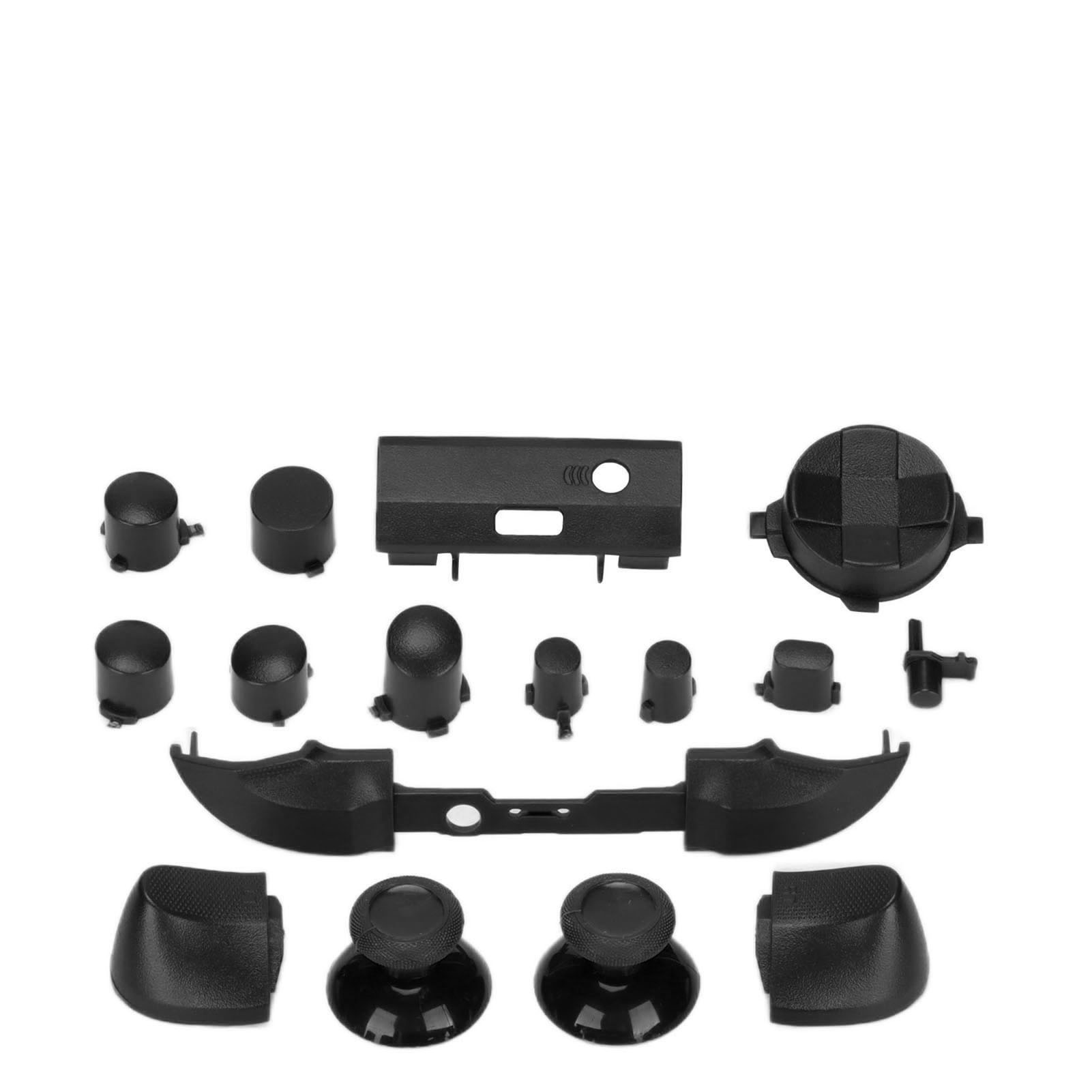 Schwarze Controller-Teile sind auf einer weißen Oberfläche angeordnet. Sie haben verschiedene Formen und Größen, darunter Knöpfe, Sticks und Trigger.