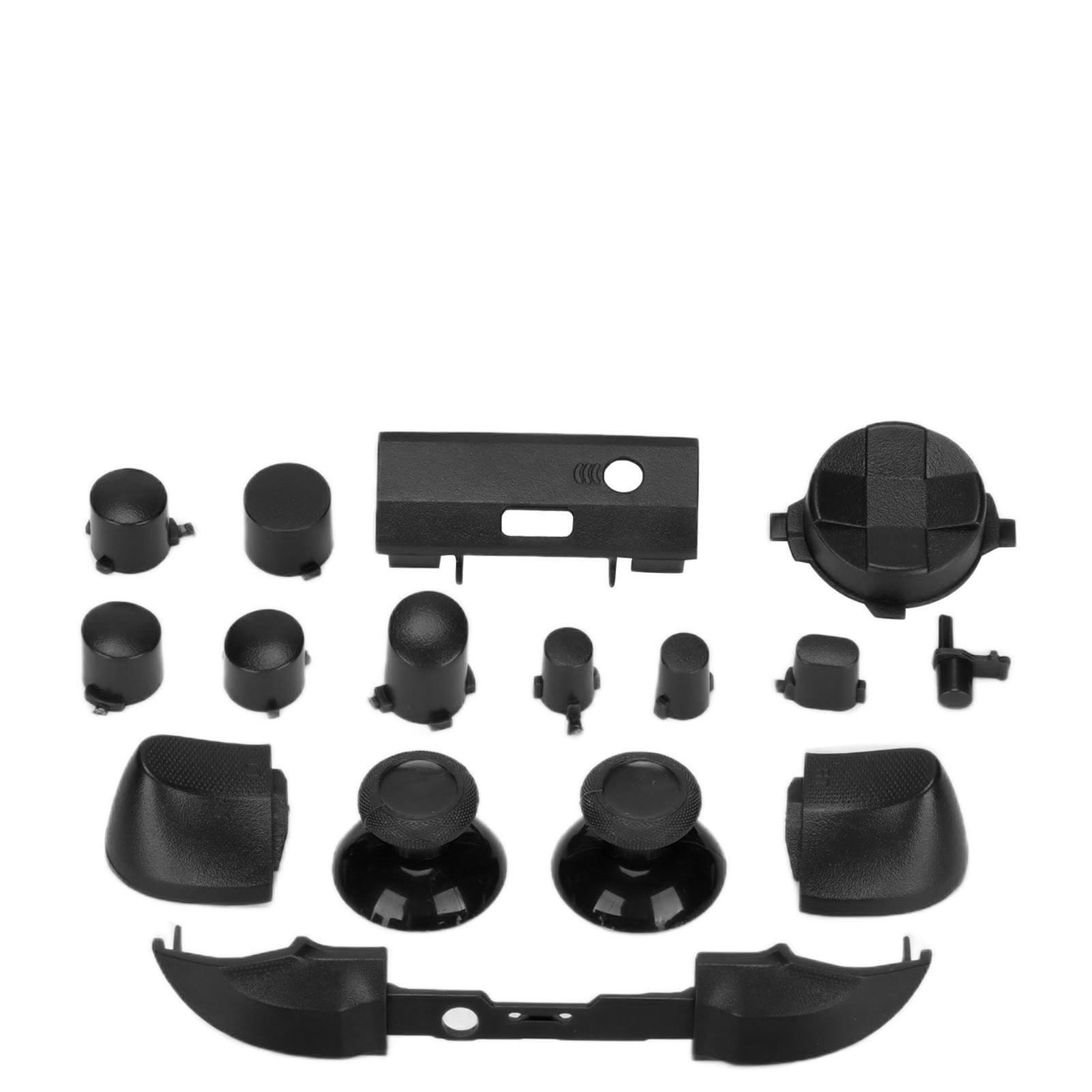 Verschiedene schwarze Komponenten für einen Gamecontroller, einschließlich Knöpfen, Joysticks und einem Mittelteil.