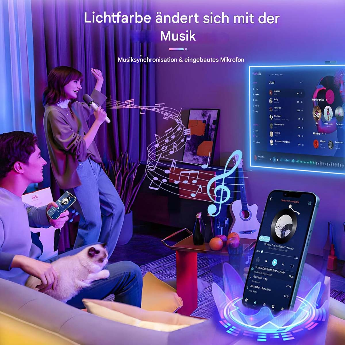 Eine Frau singt in ein Mikrofon, ein Mann hält ein Telefon, und eine Katze sitzt. Bildschirm zeigt Musikvisualisierung.