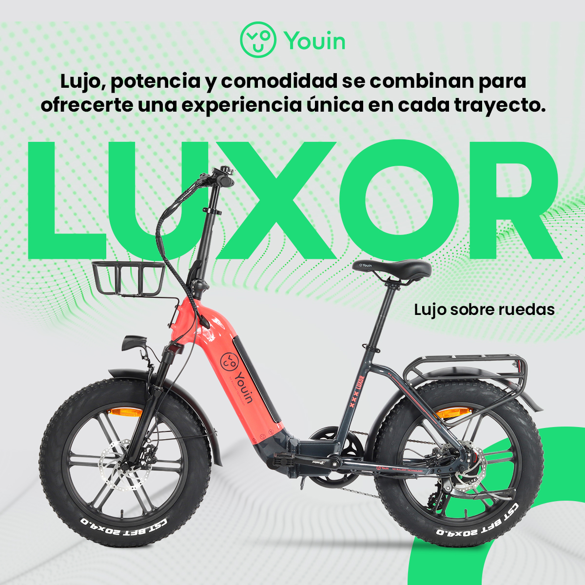 Bicicleta eléctrica Luxor roja y negra con texto verde. Texto: Lujo sobre ruedas.