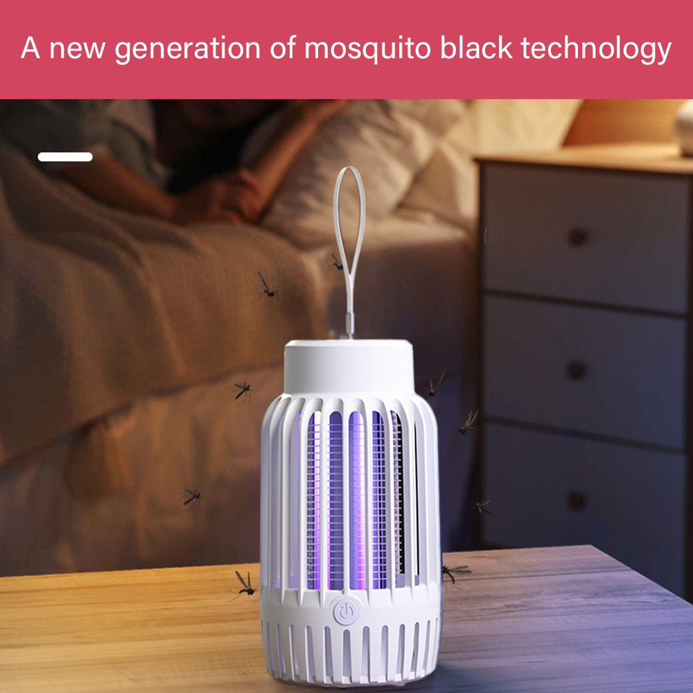 Ein weißer Moskitokiller auf einem Tisch, der violettes Licht aussendet. Moskitos werden angezogen.