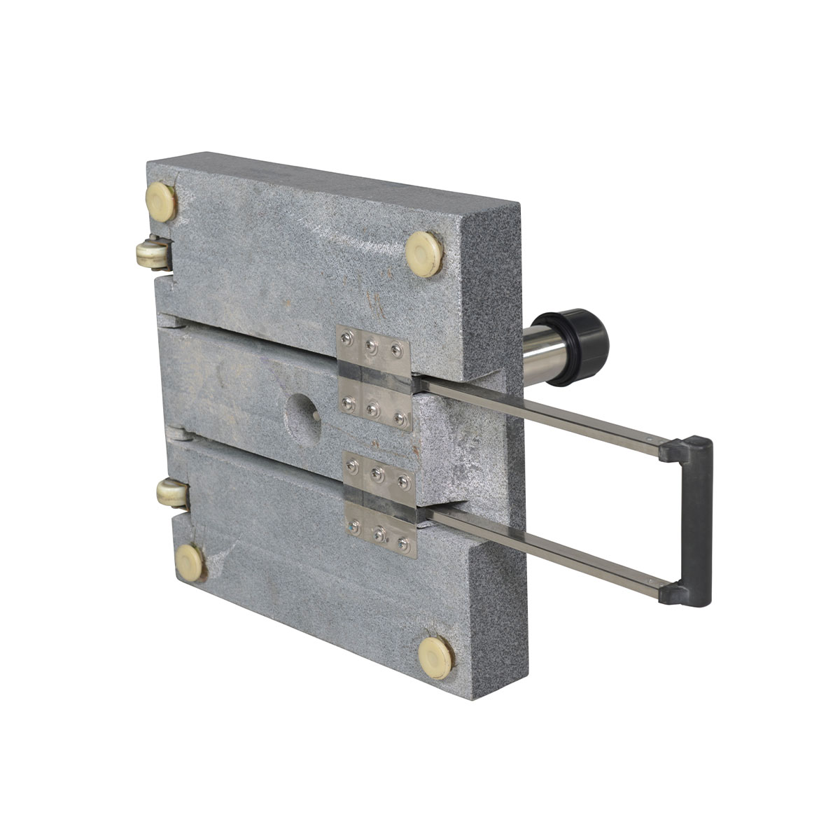 A heavy granite block with a metal handle and wheels. There are metal plates and bolts on the block.