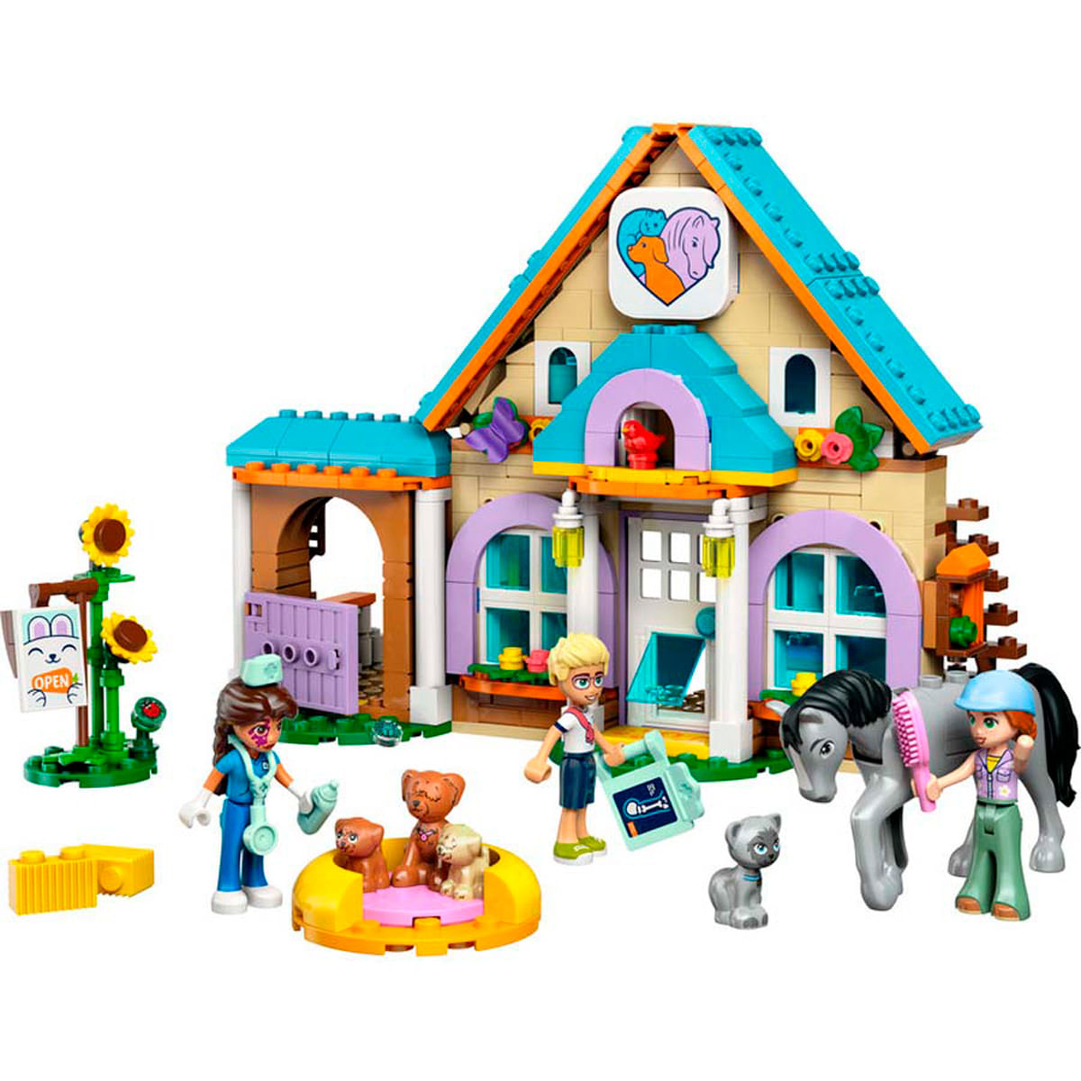 Ensemble Lego avec un cabinet vétérinaire, des animaux et des figurines.