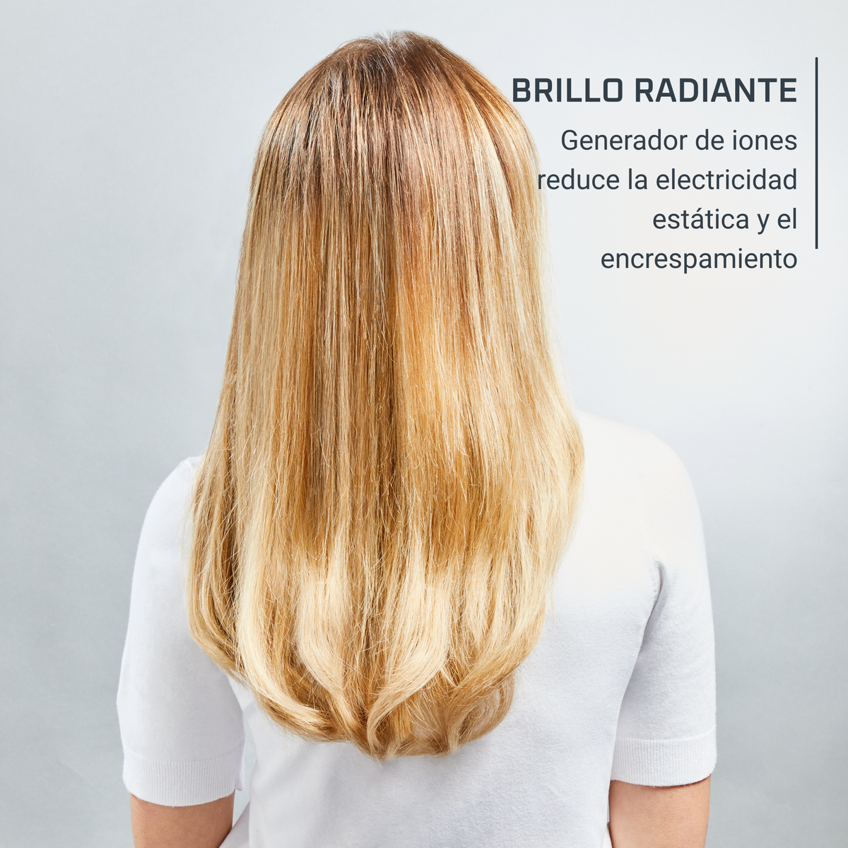 Plecy kobiety z długimi blond włosami, tekst mówi, że generator redukuje elektryzowanie się włosów.