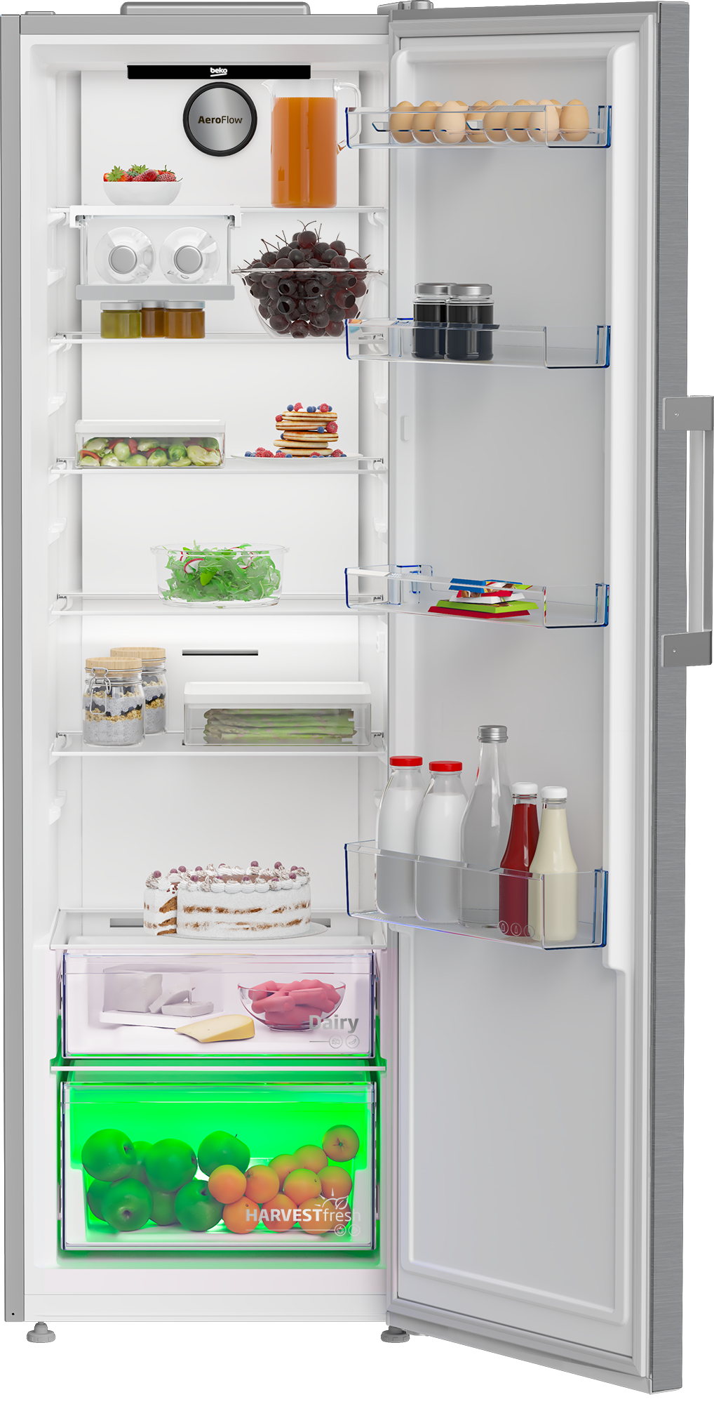 Dentro de una nevera, frutas, verduras y varios alimentos están cuidadosamente colocados en los estantes.