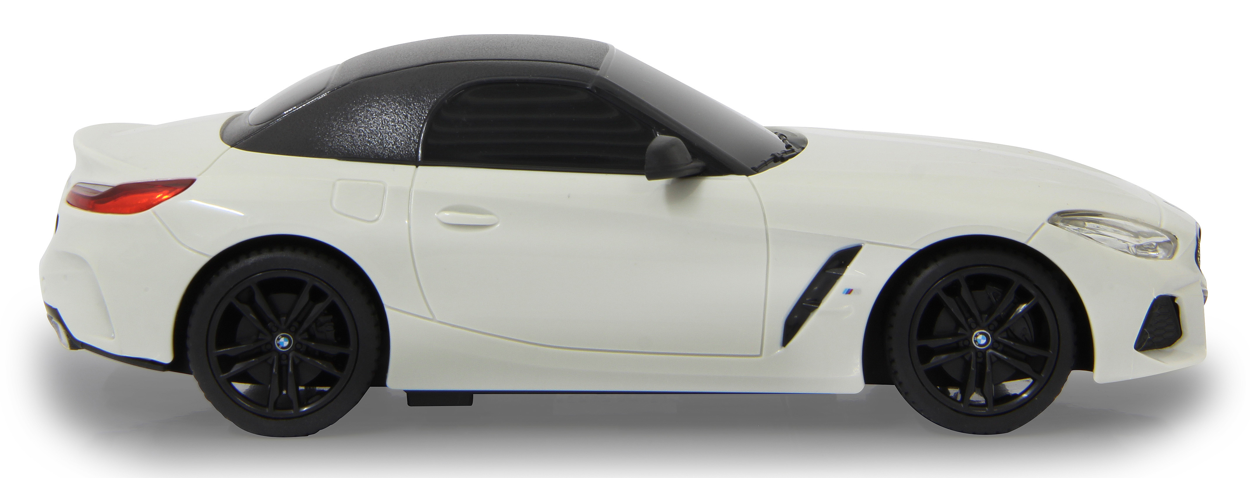 Weißes BMW Z4 Cabrio mit schwarzem Dach und schwarzen Rädern, Seitenansicht.