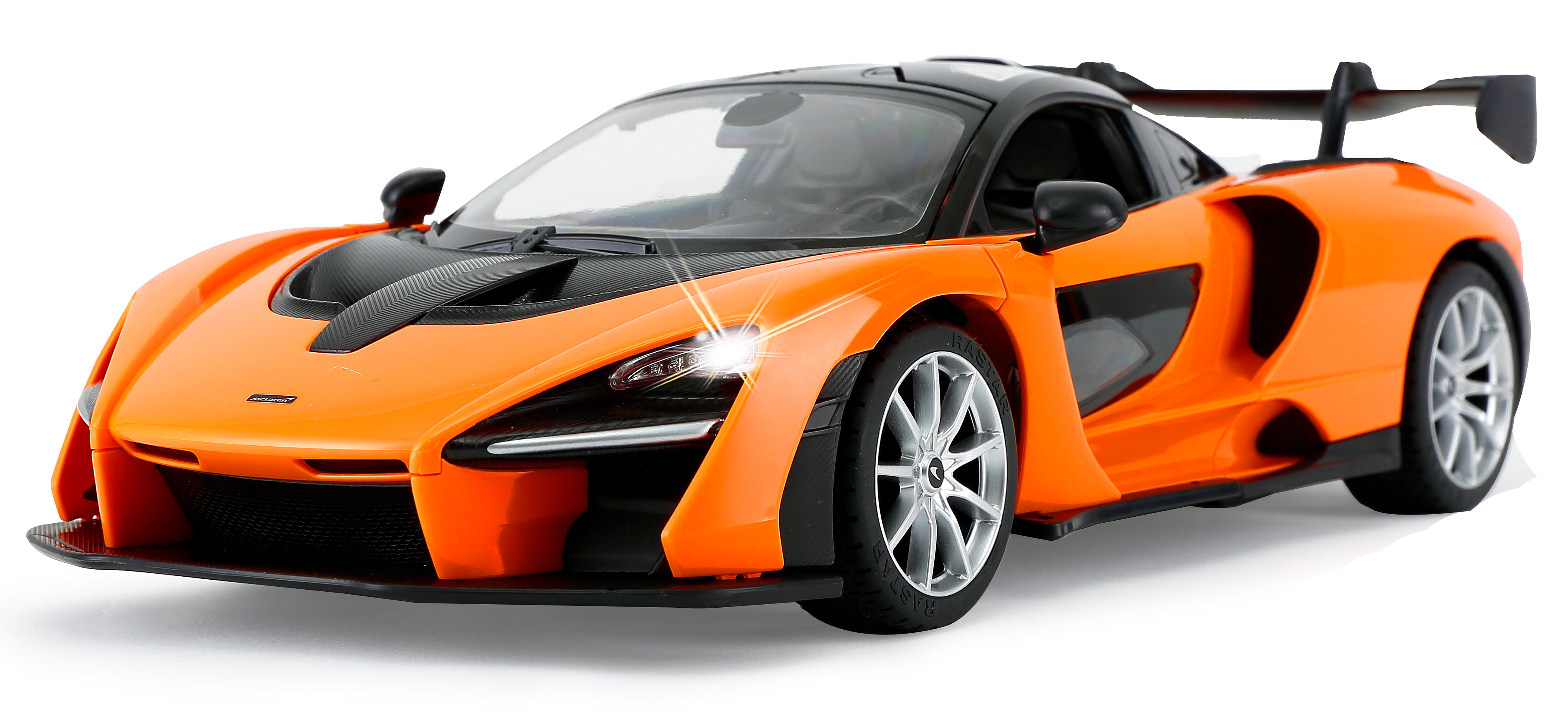 Oranges McLaren-Spielzeugauto mit schwarzem Dach, eingeschalteten Scheinwerfern und Rädern. Es ist nach rechts abgewinkelt.