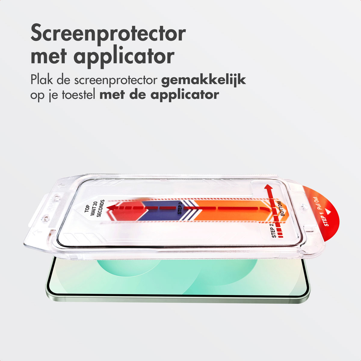 Un proteggi schermo con un applicatore, posto sopra un telefono. Testo sull'applicatore.
