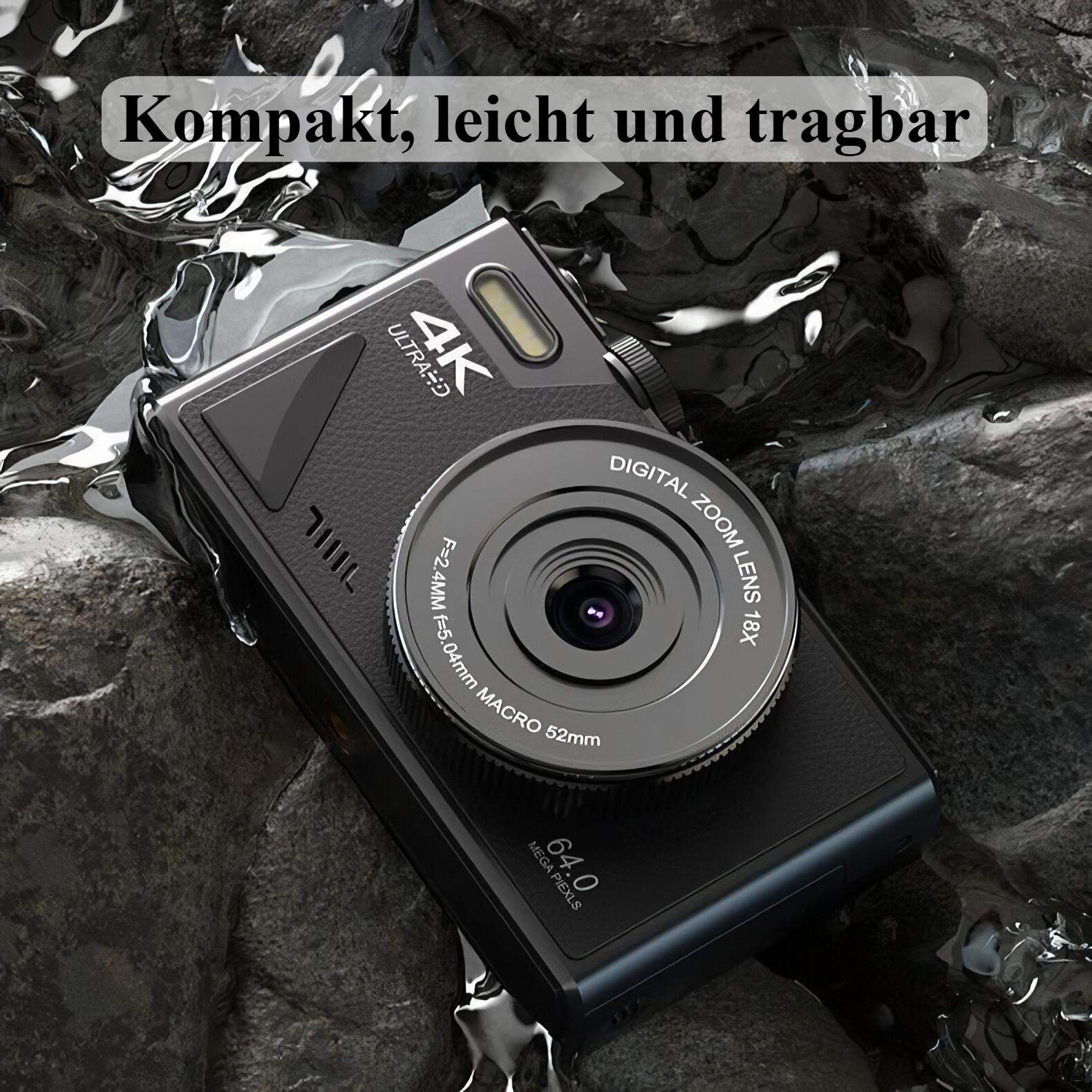 Eine schwarze Digitalkamera auf einer Steinoberfläche, teilweise in Wasser getaucht.