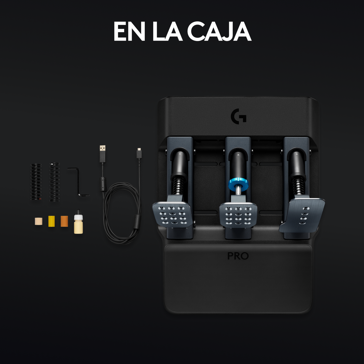 Czarny zestaw zawiera trzy pedały, kable i dodatkowe części na czarnej powierzchni, z tekstem 'EN LA CAJA'.