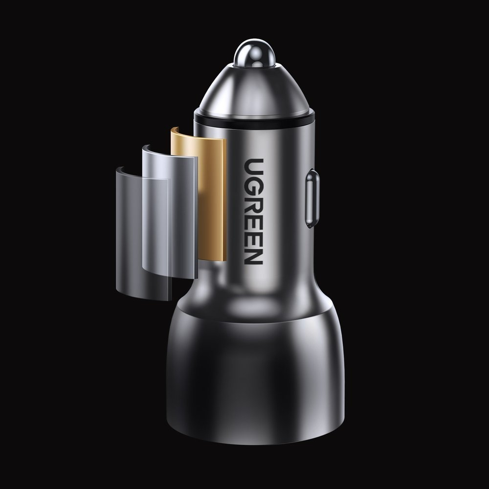 Widok rozłożony srebrnej ładowarki samochodowej UGREEN, ukazujący elementy wewnętrzne w kolorze złotym i srebrnym.
