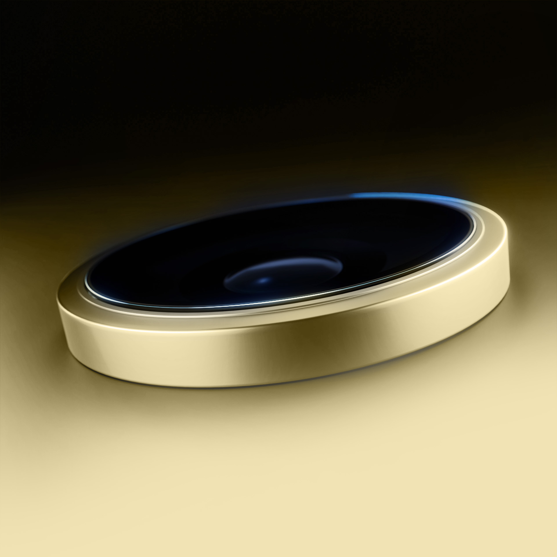 Un dispositivo circolare color oro con una superficie nera. È presentato su uno sfondo sfumato oro e nero.