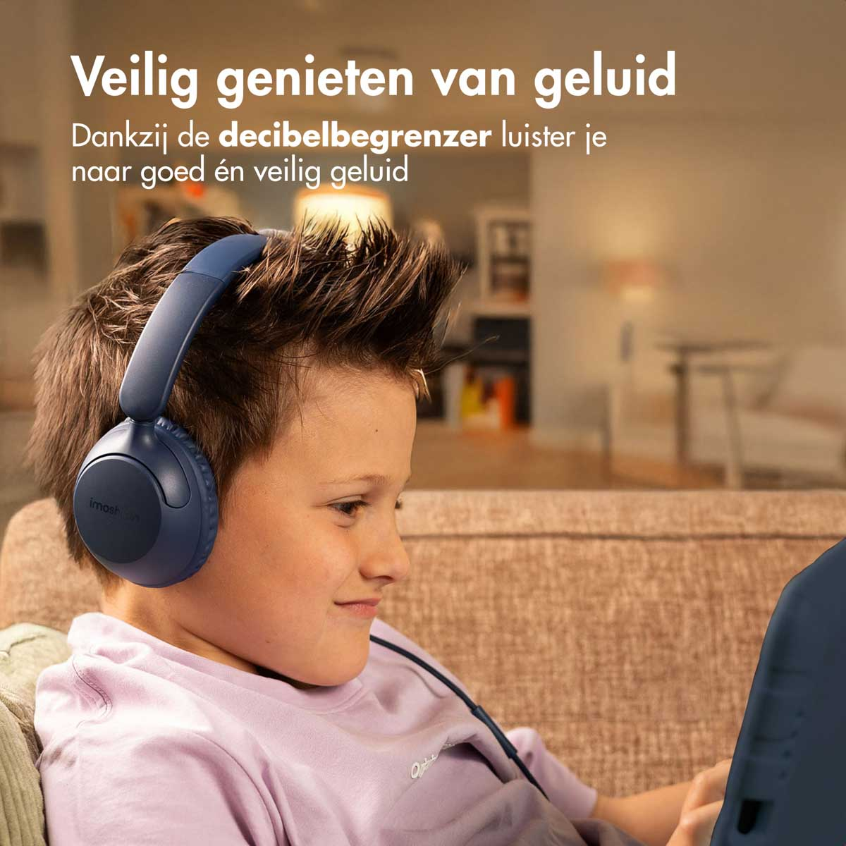 Boy wearing blue headphones, watching a tablet. Text says safe enjoyment of sound.