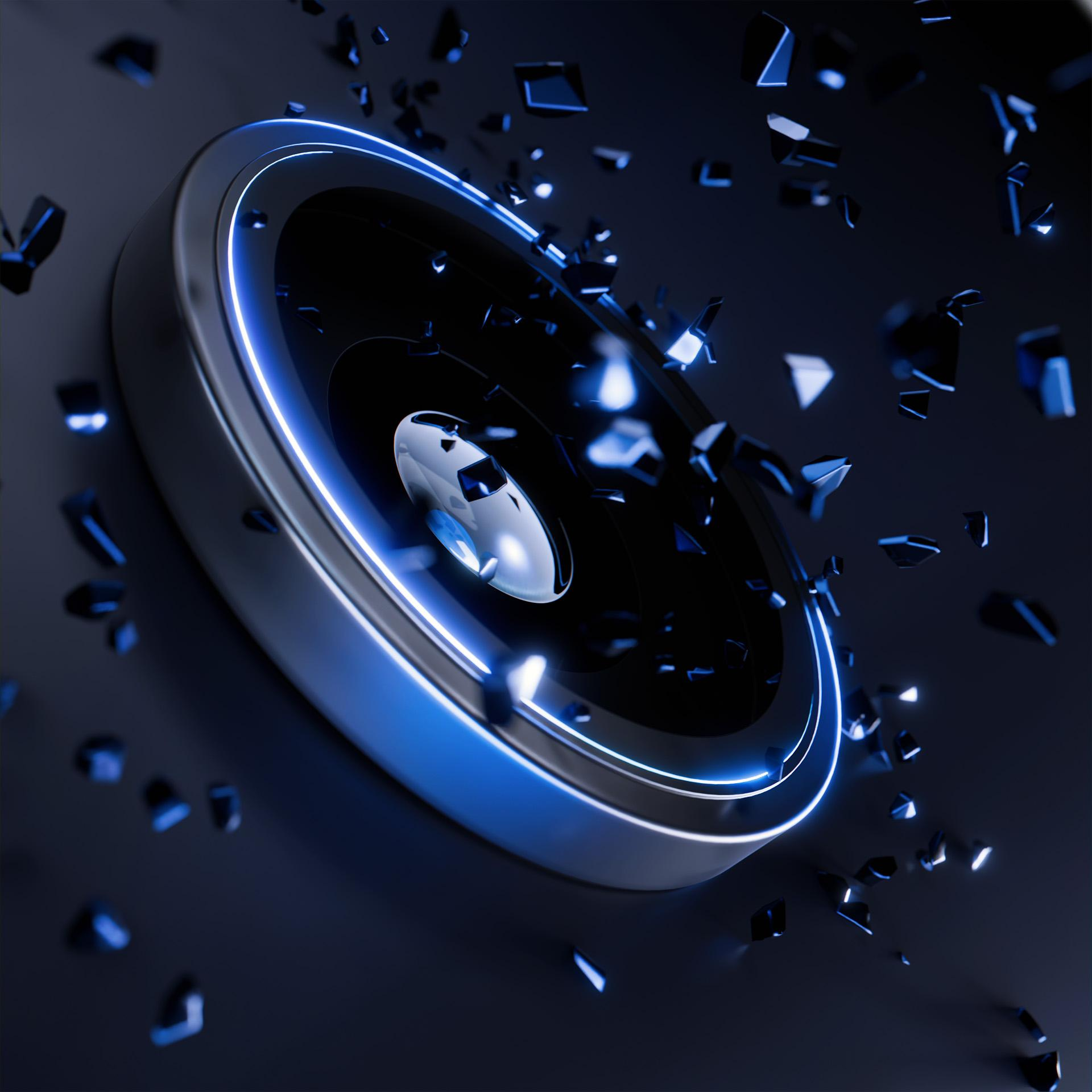 Głośnik z niebieskim światłem wokół, eksplodujący z niebieskimi odłamkami. Ciemne, rozmyte tło.