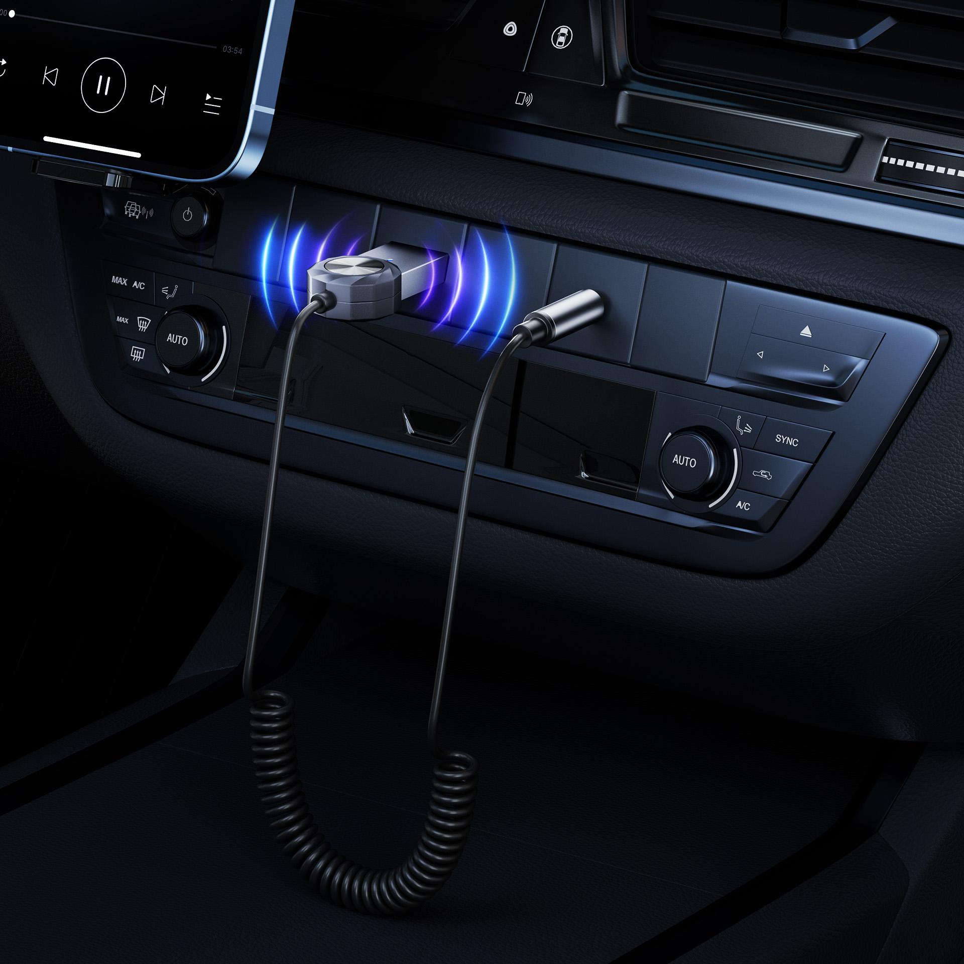 Konsola samochodowa z adapterem Bluetooth podłączonym do telefonu. Niebieskie fale.