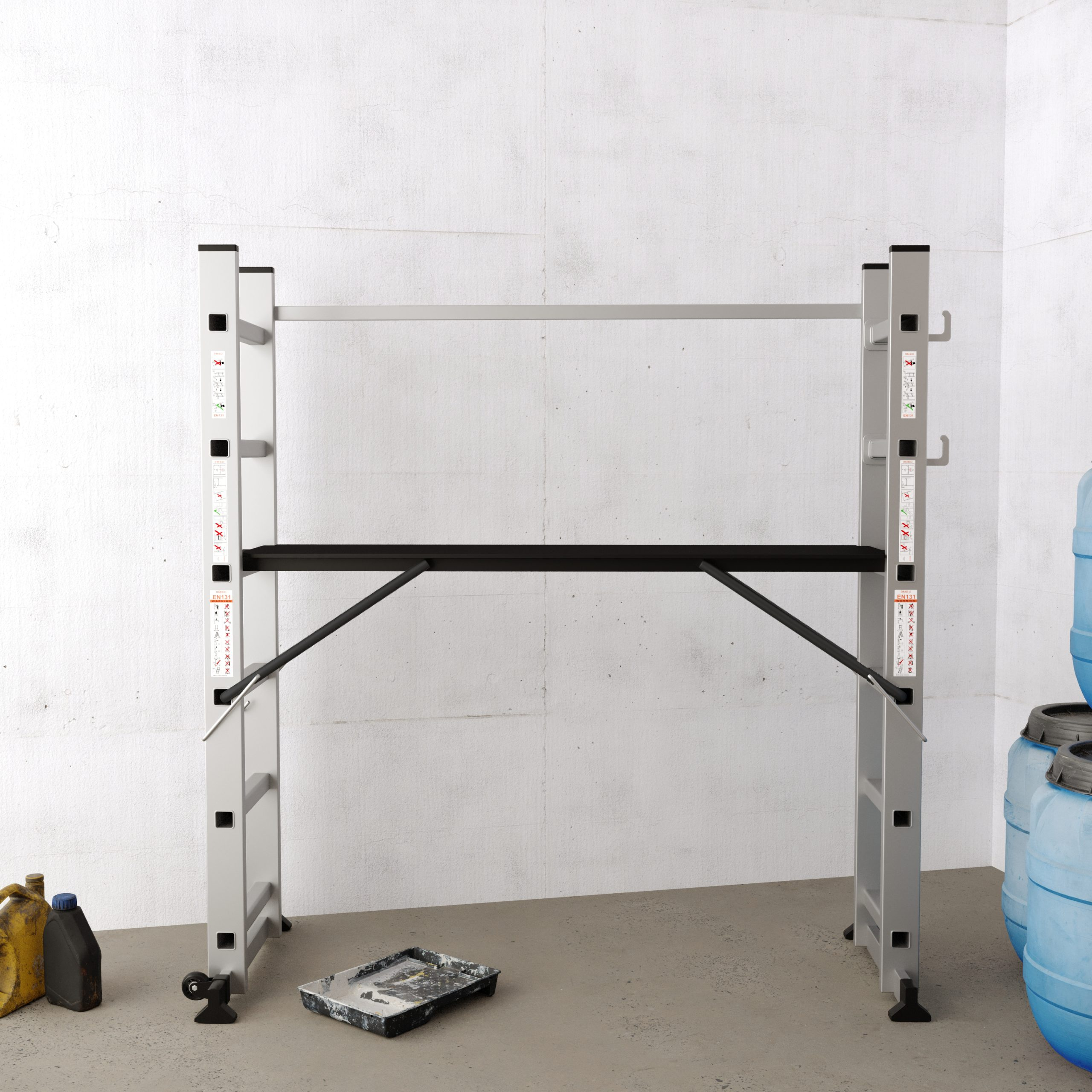 A scaffold set up indoors against a textured wall. There is a paint tray and some blue barrels next to it.