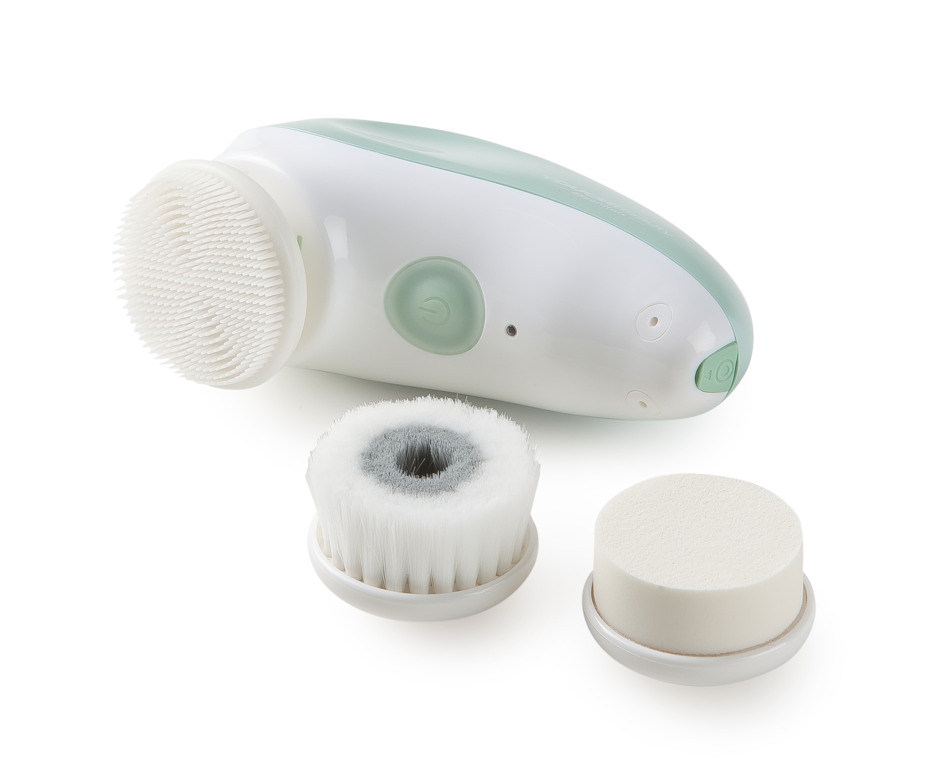 Een witte en groene gezichtsborstel met drie opzetstukken: een borstel, een zachte borstel en een kleine spons.
