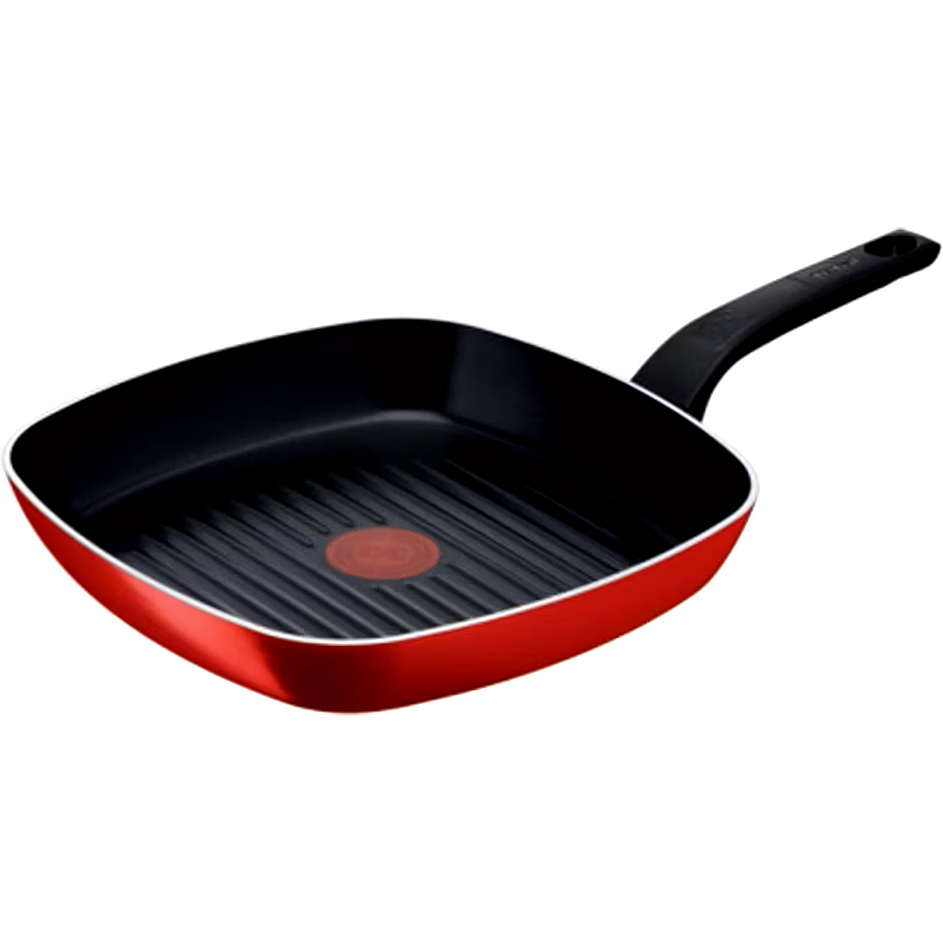 Rote und schwarze quadratische Grillpfanne mit schwarzem Griff. Die Pfanne befindet sich auf weißem Hintergrund.