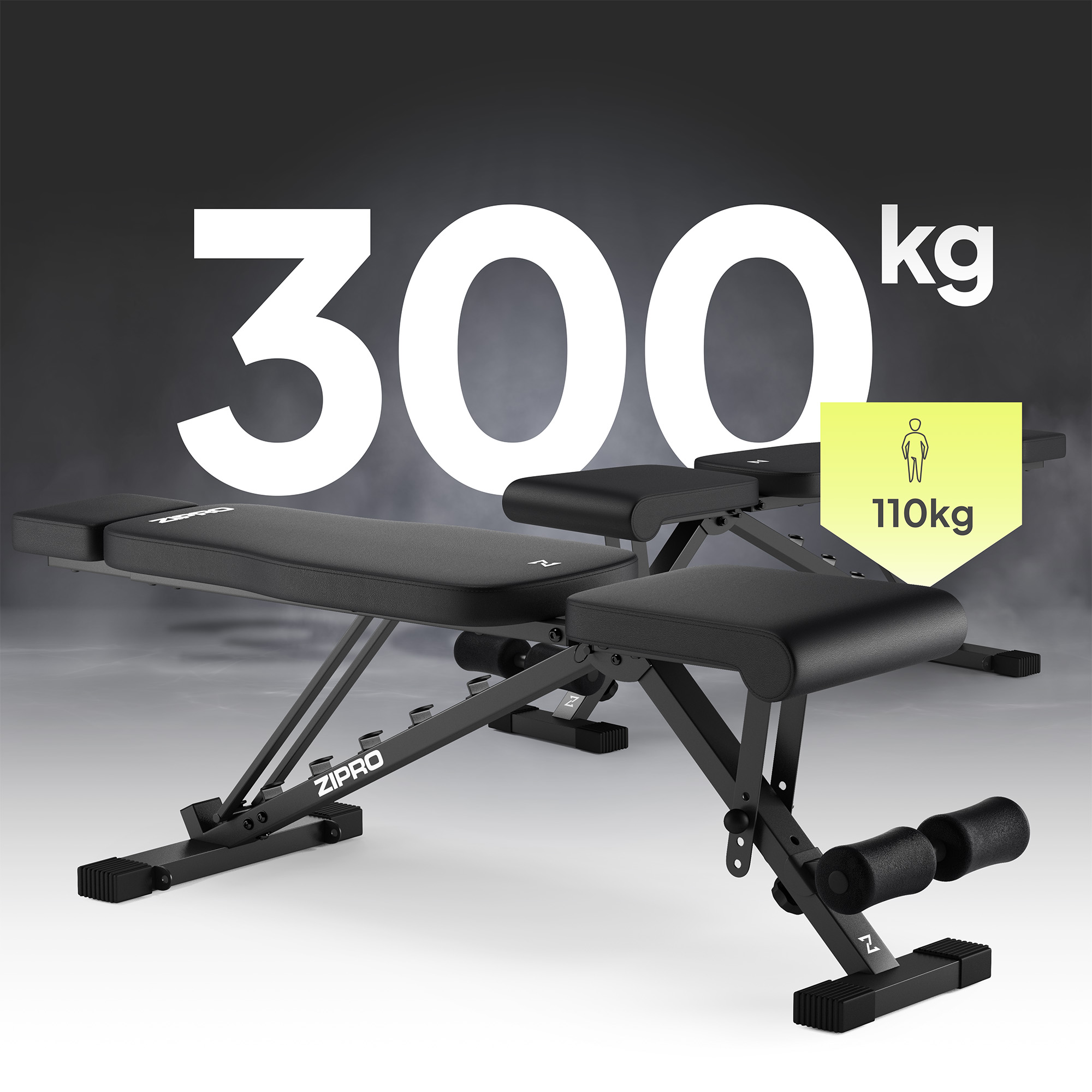 Schwarze Trainingsbank. Kapazität 300 kg. Personensymbol zeigt 110 kg Limit. Hintergrund grau.