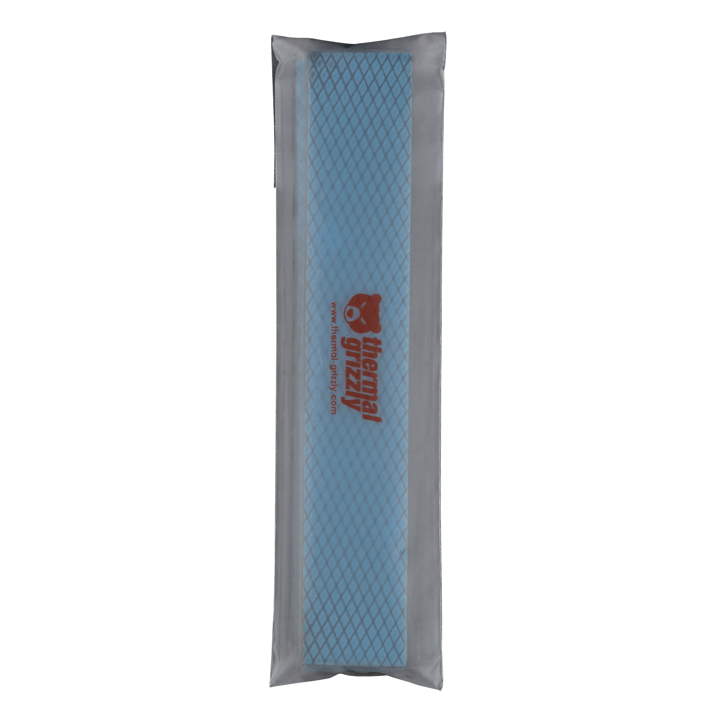 Ein Wärmeleitpad in einer transparenten Plastikhülle auf schwarzem Hintergrund.