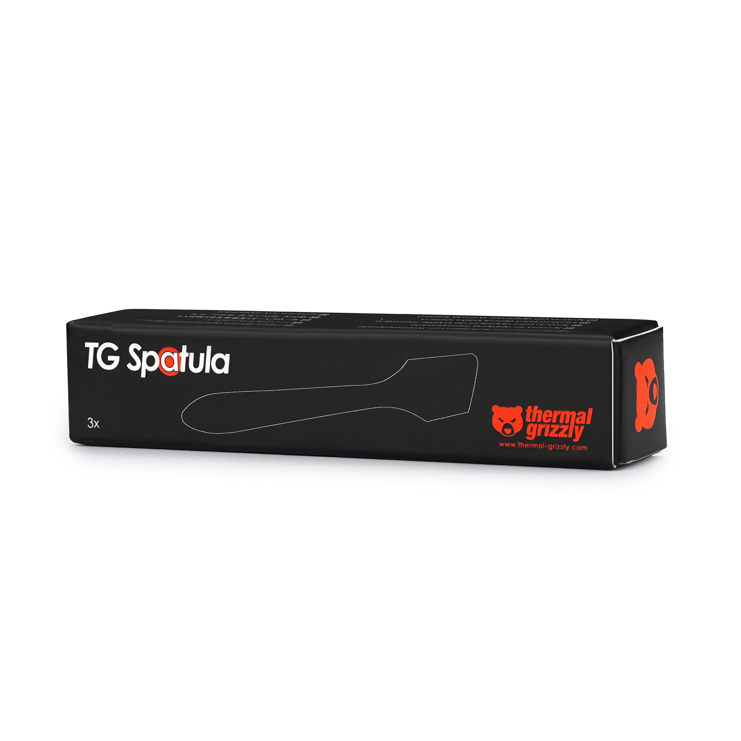 Schwarze Schachtel mit 'TG Spatula' Text und einer Spatel-Umrisslinie. Auf weißem Hintergrund.