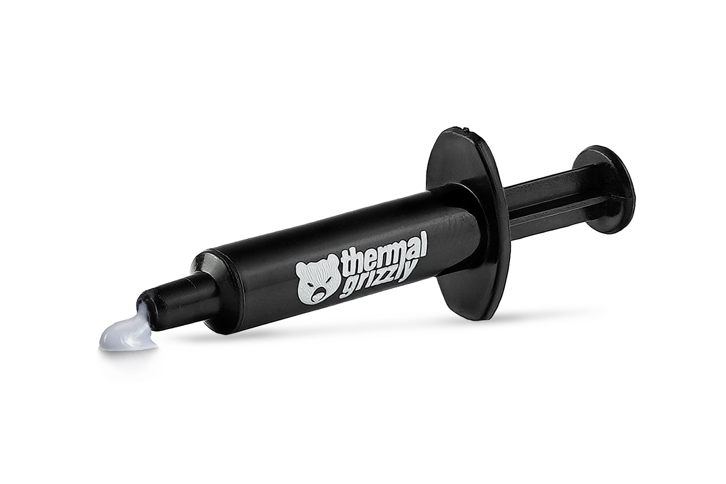 Jeringa negra con pasta térmica, logo blanco de Thermal Grizzly. La pasta es visible en la punta.