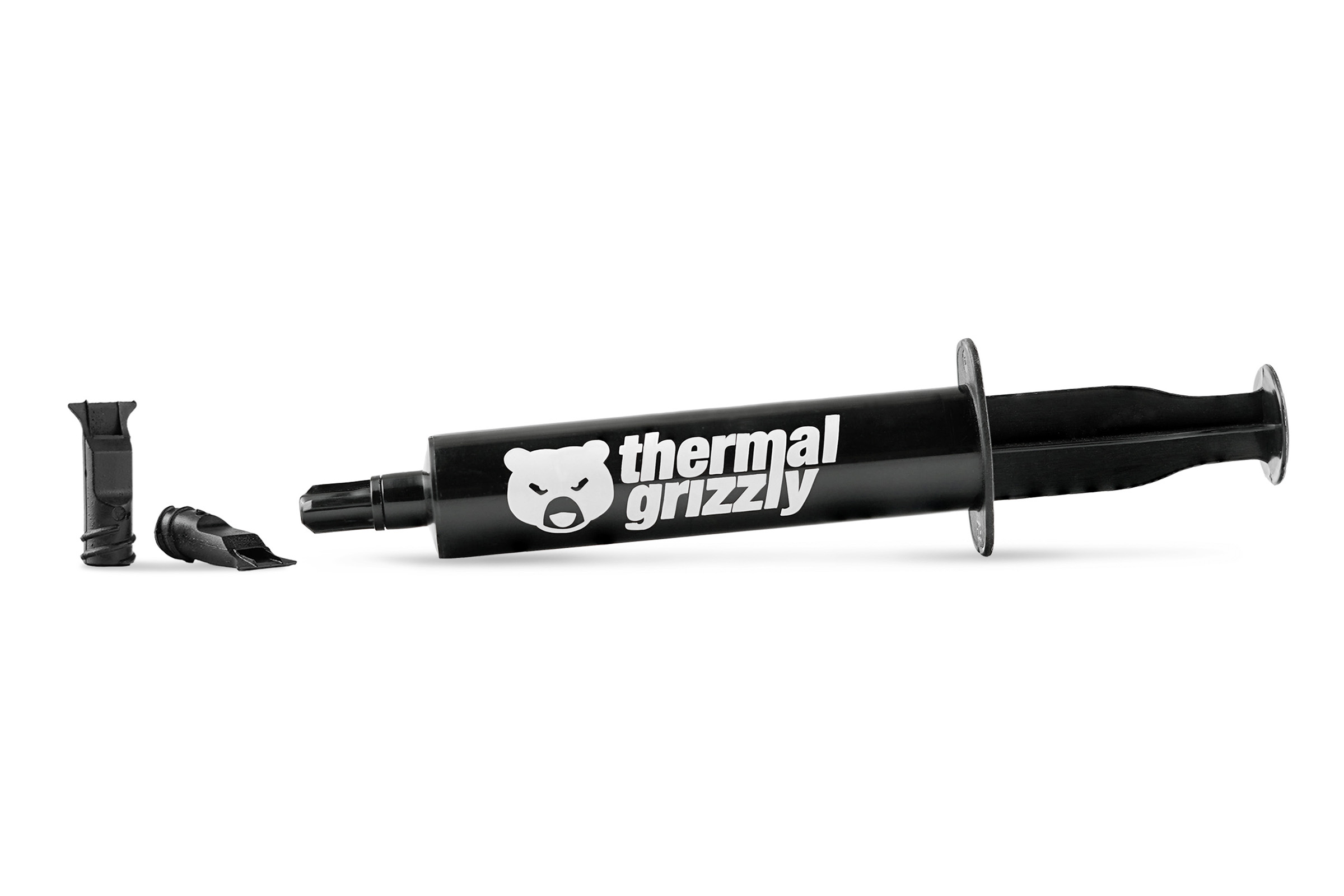 Una jeringa negra y dos boquillas con el logo 'thermal grizzly' sobre fondo blanco. Componentes dispersos.