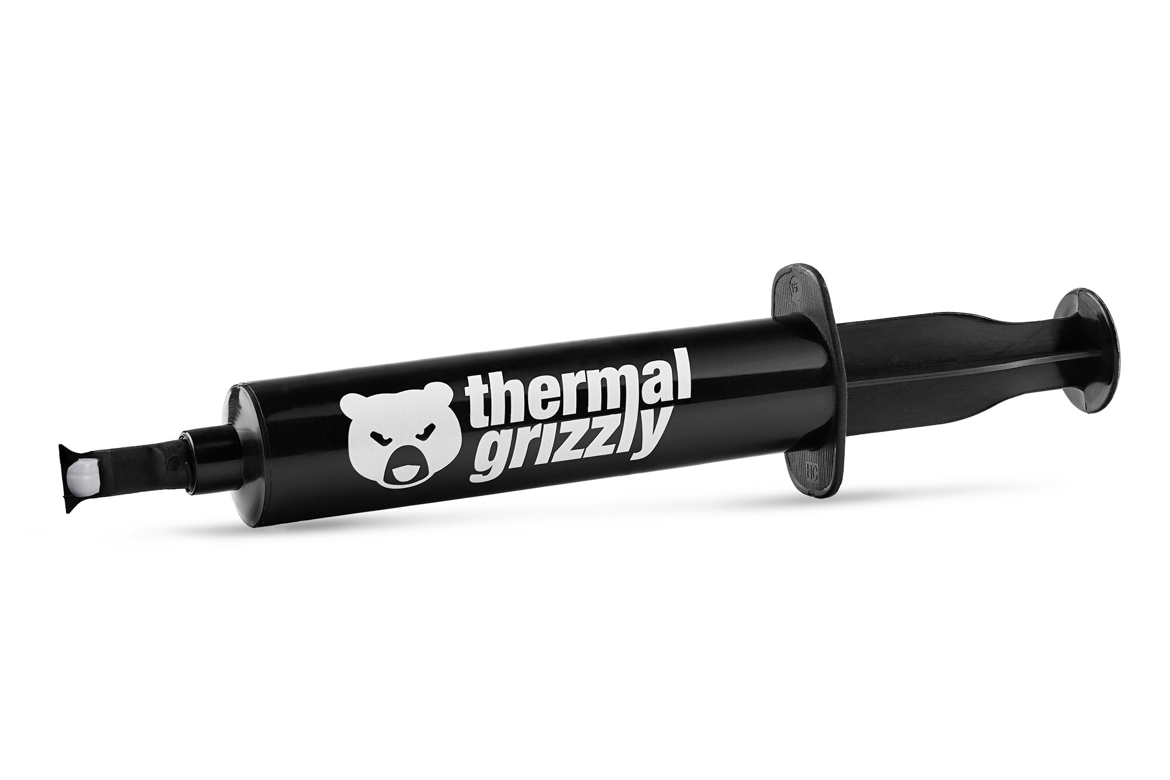 Jeringa negra con la marca thermal grizzly. La jeringa tiene una sustancia blanca saliendo.