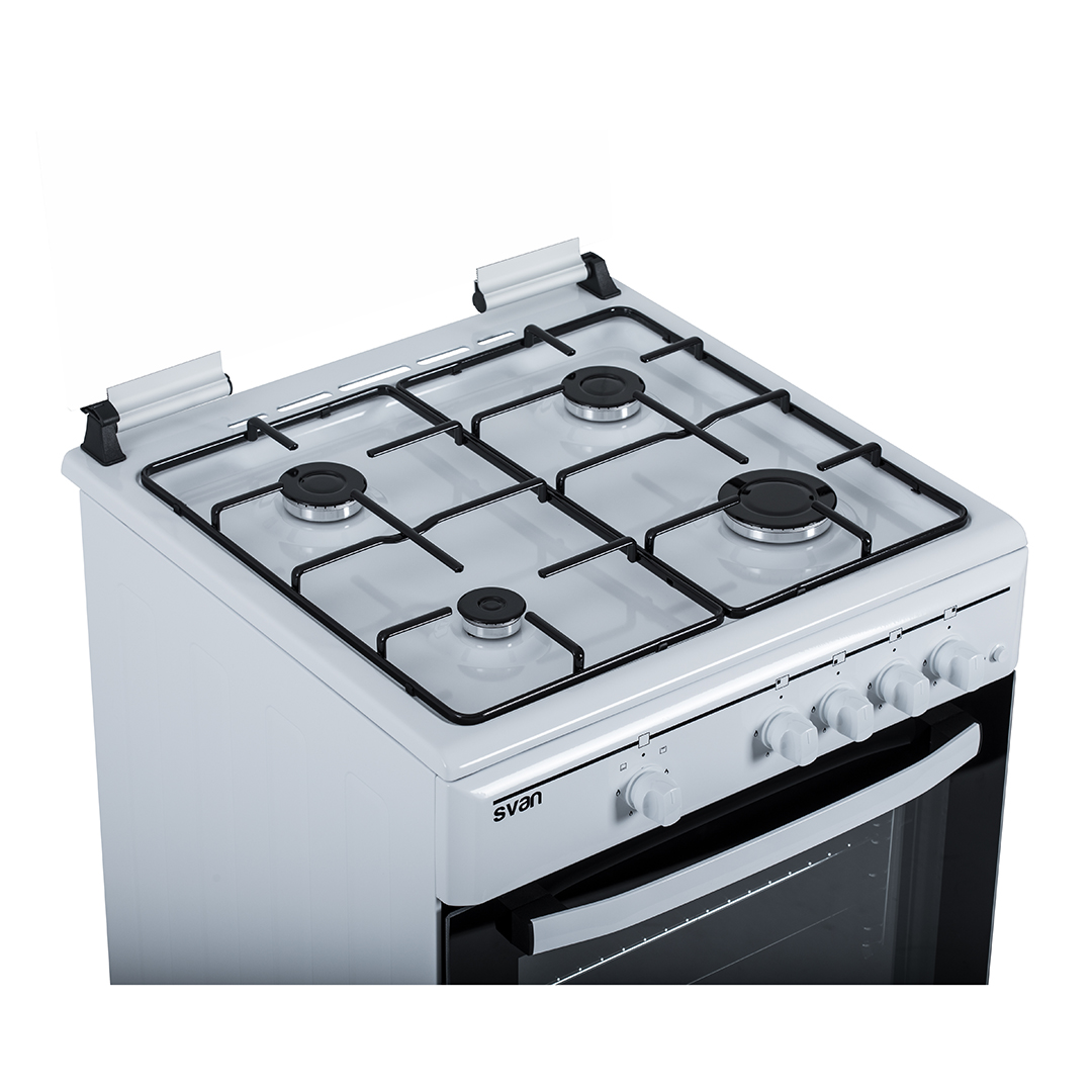 Vista superior de una cocina de gas blanca con cuatro quemadores y una rejilla negra.