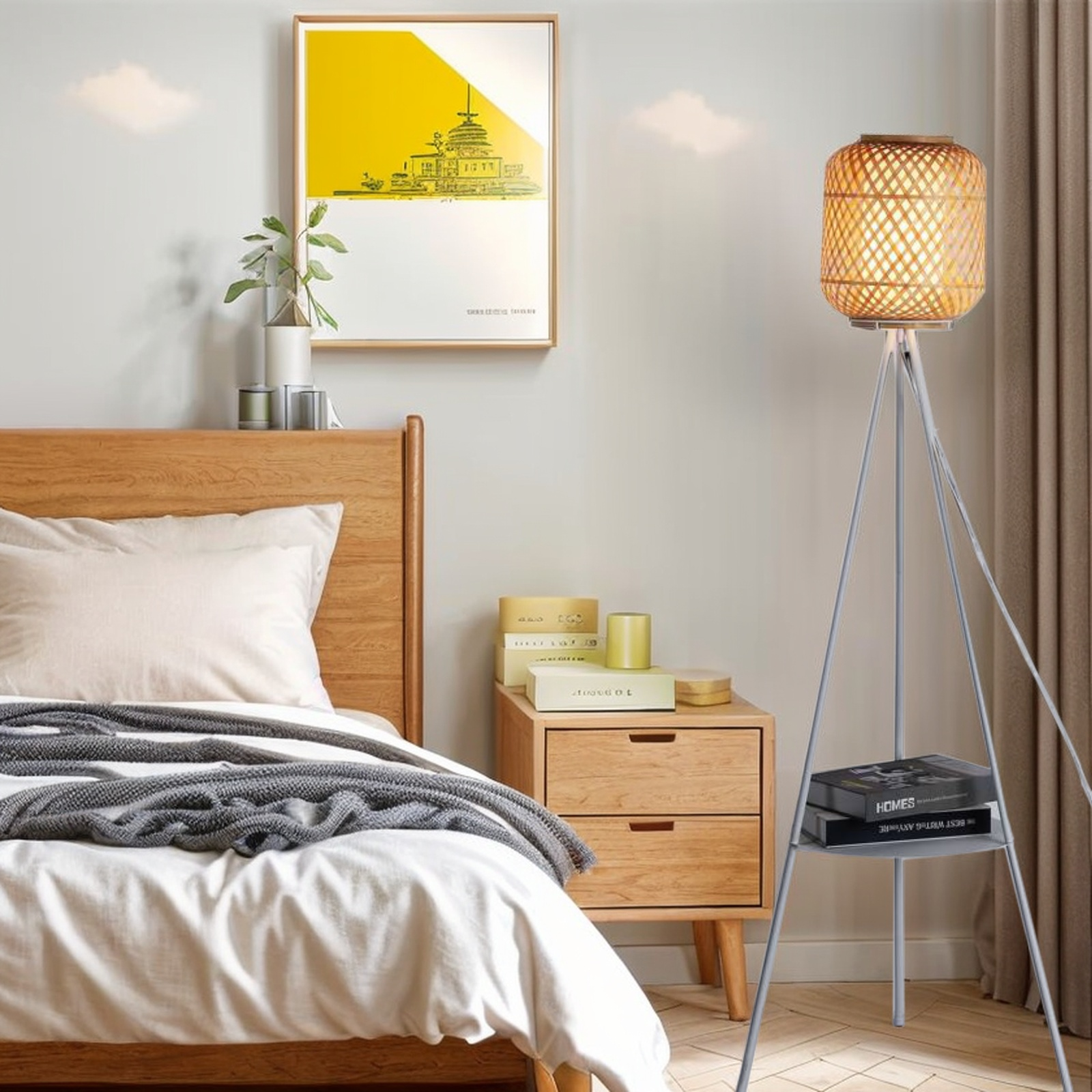 Una lámpara de bambú sobre un trípode, junto a una cama y una pintura amarilla en la pared.