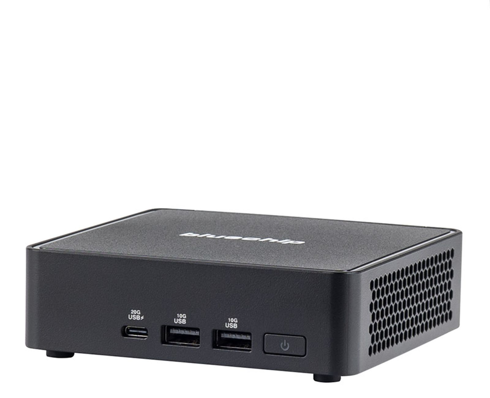 Piccolo computer nero con più porte USB e un pulsante di accensione, su una superficie bianca.