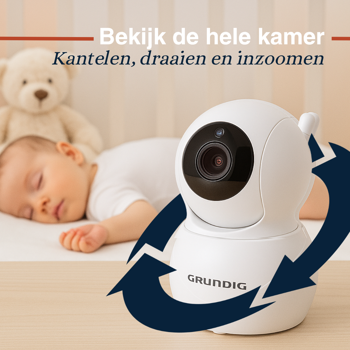 A white baby monitor with a baby sleeping in the background. The monitor is on a wooden surface.
