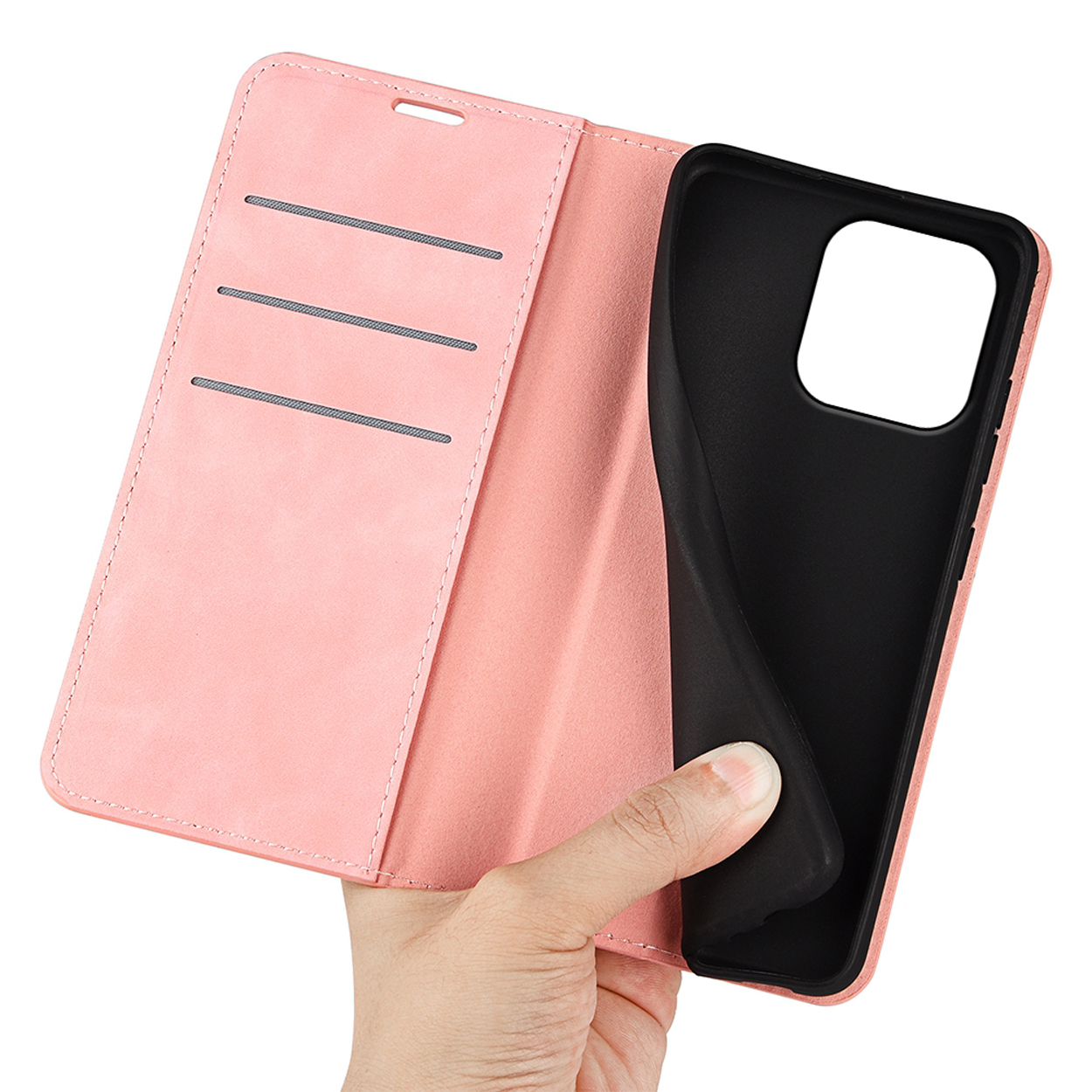 Roze telefoonhoes, open. Hand houdt telefoon vast. Binnenkant van de hoes zichtbaar.