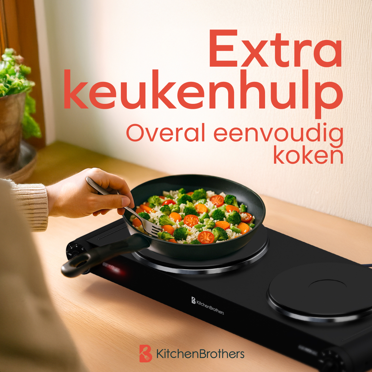 Person cooking with a double burner cooktop. Vegetables in a pan. Wooden countertop.