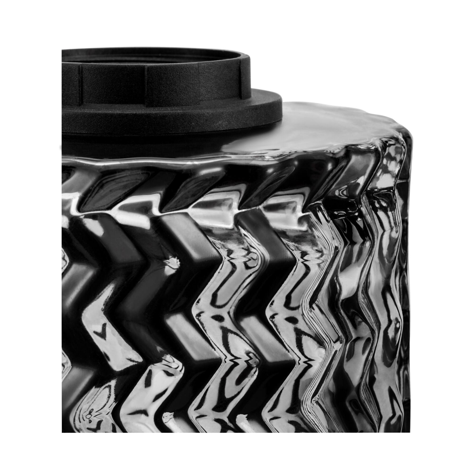 Czarna i przezroczysta szklana podstawa lampy ze wzorem zygzaka.